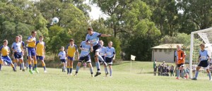 Millsy rises like a salmon to head clear from a corner